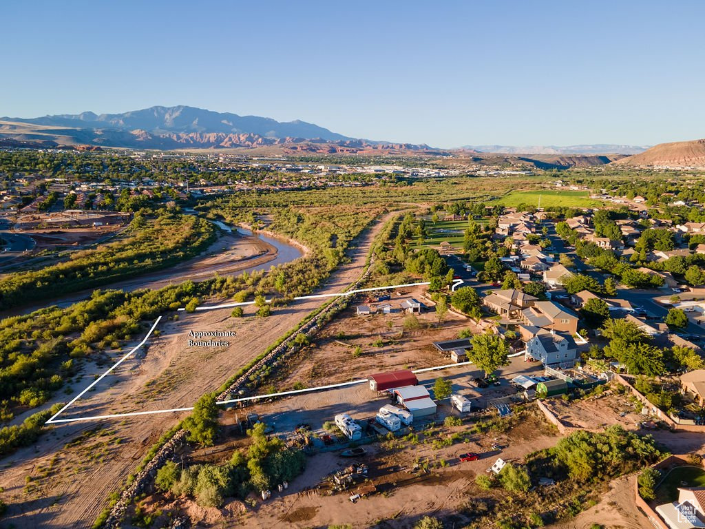 Birds eye view of property with a mountain view