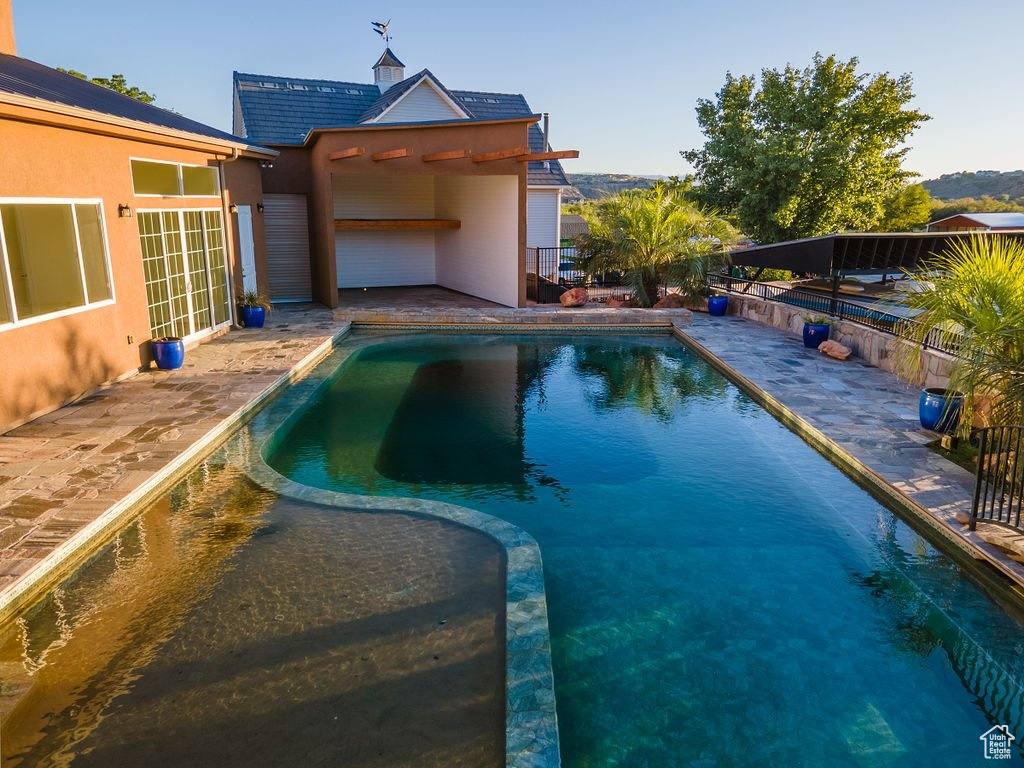 View of pool with a patio area