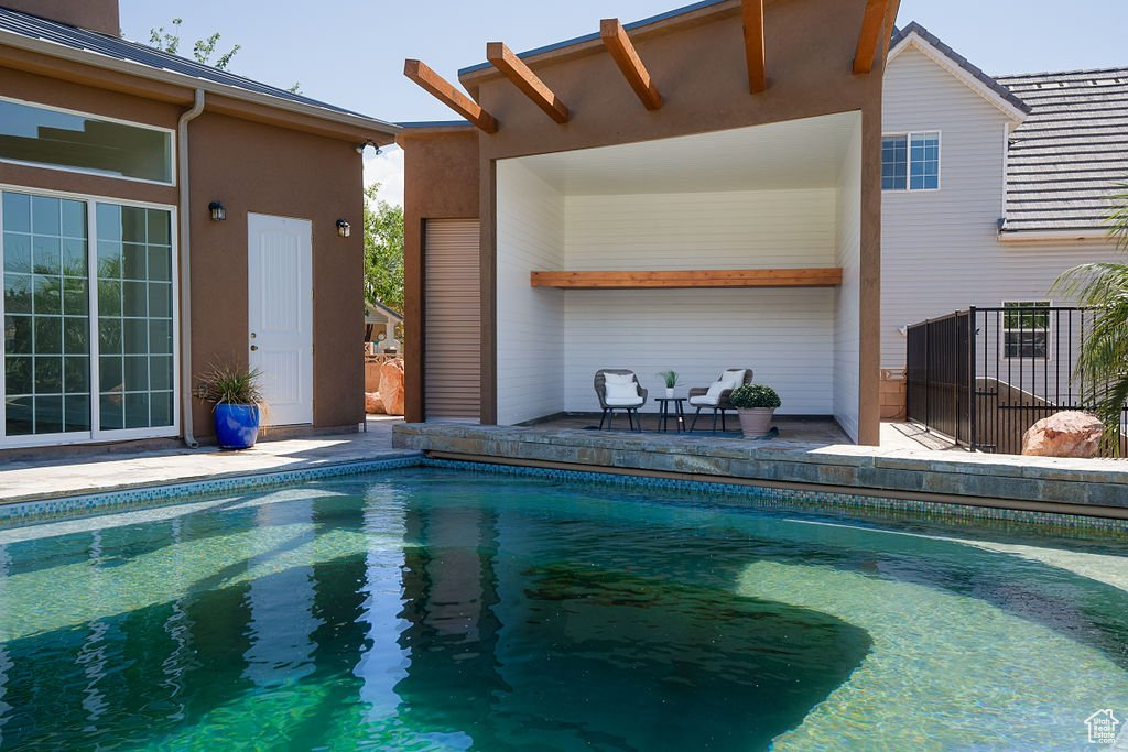 View of swimming pool featuring a patio area