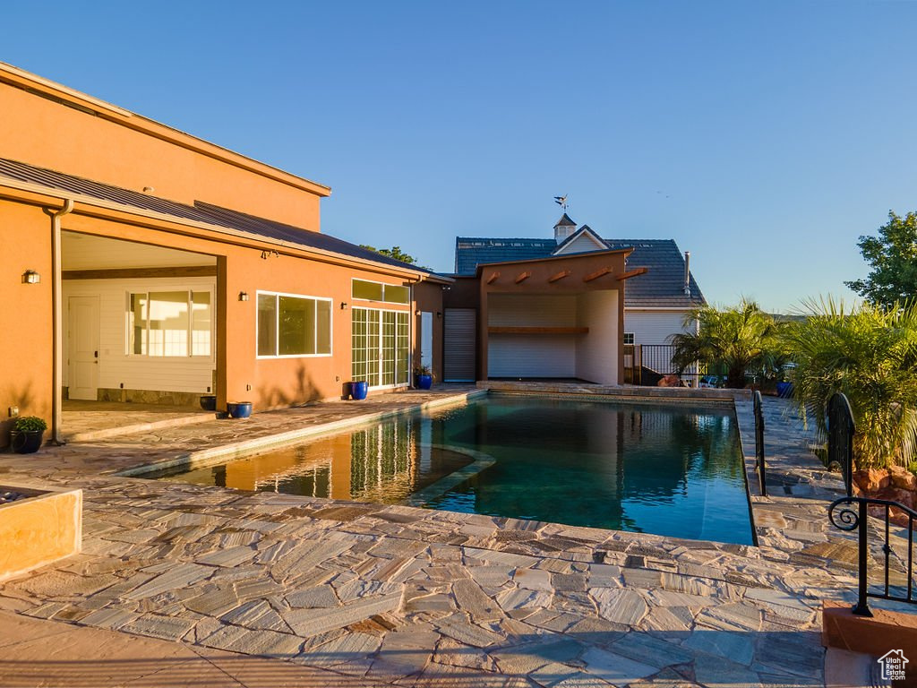 View of swimming pool featuring a patio