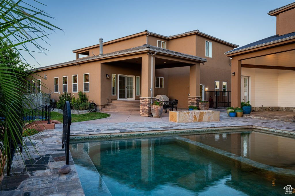 View of swimming pool with a patio area