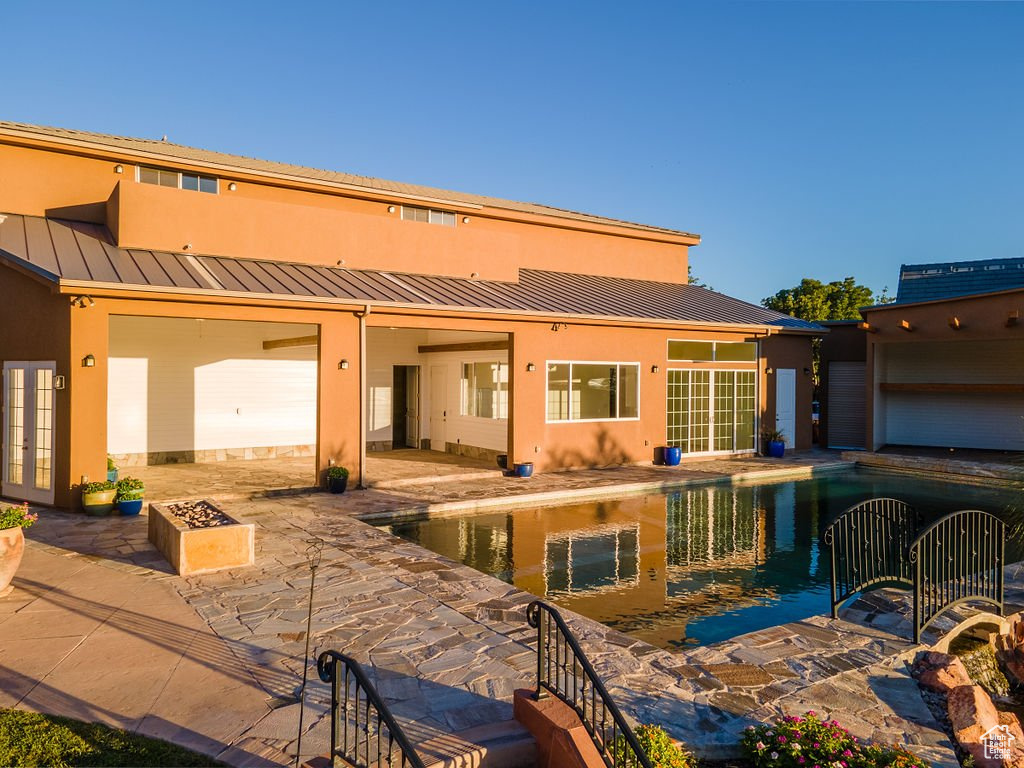 Rear view of property with a patio