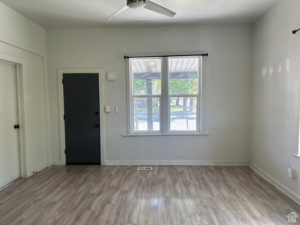 Foyer entrance featuring light hardwood / wood-style floors and ceiling fan