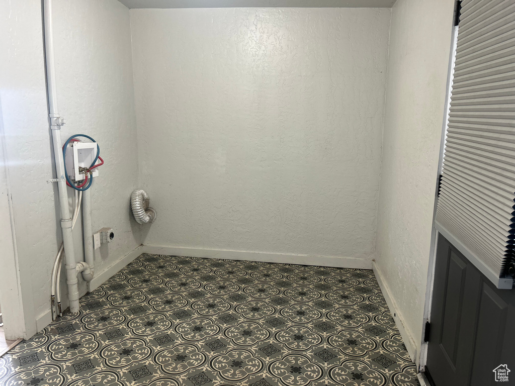 Laundry room with hookup for a washing machine and hookup for an electric dryer