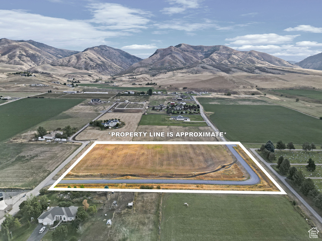 Drone / aerial view featuring a mountain view and a rural view