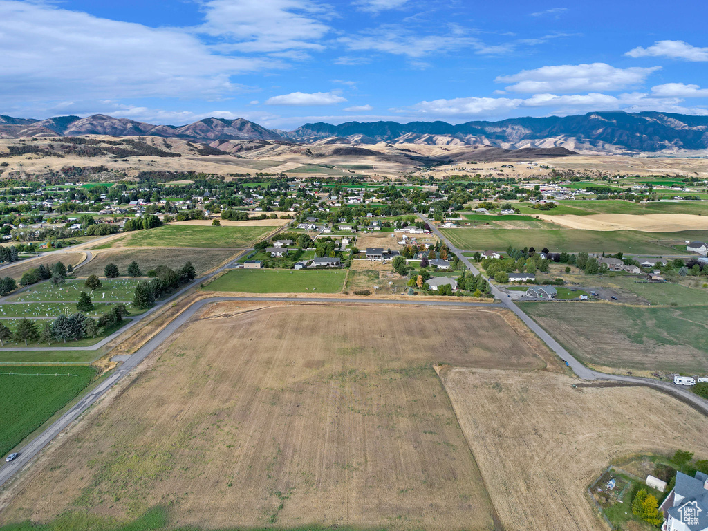 Birds eye view of property with a mountain view