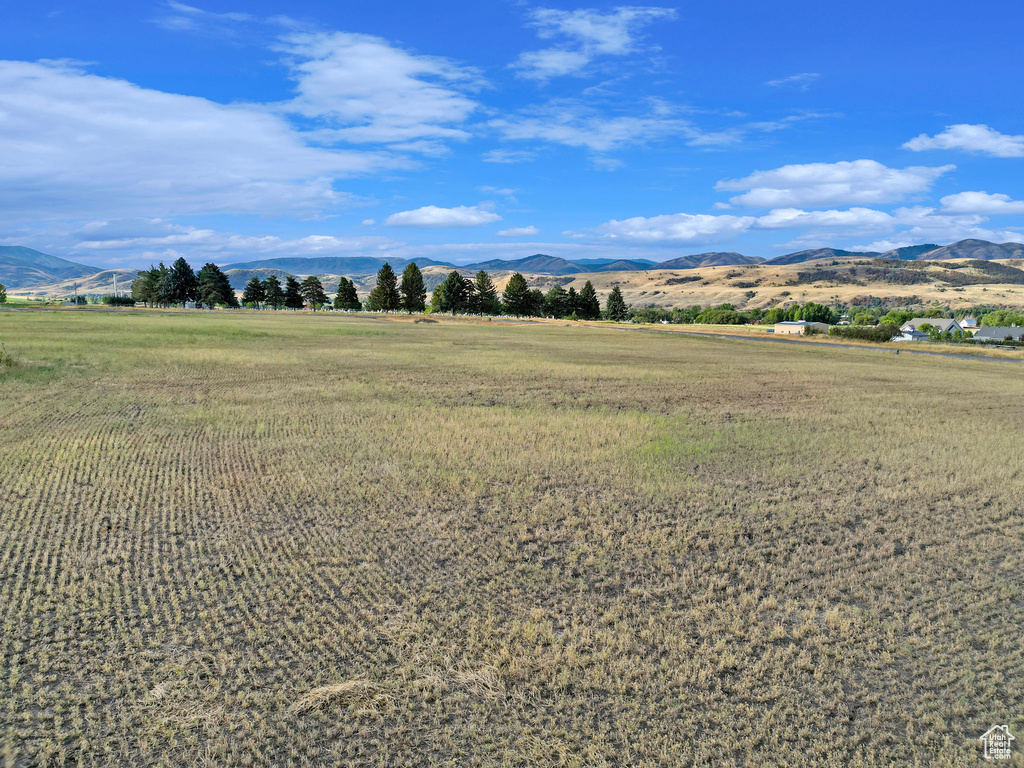 Property view of mountains with a rural view