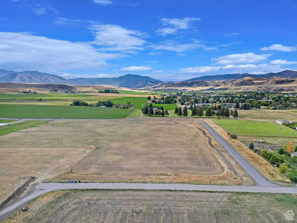 Birds eye view of property with a rural view and a mountain view