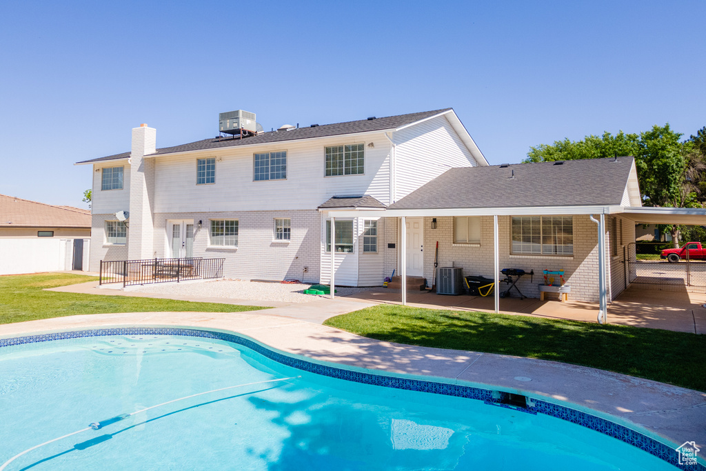 Exterior space featuring a patio and central AC unit