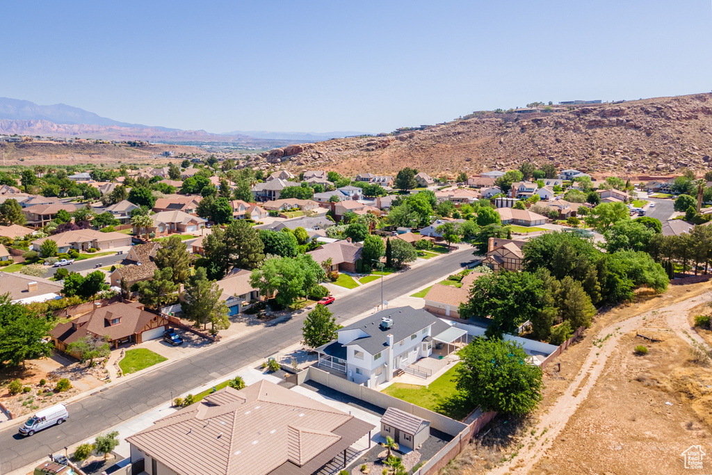 Birds eye view of property with a mountain view