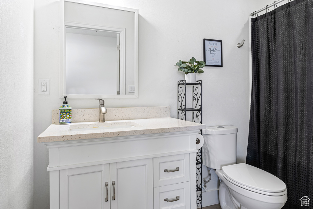 Bathroom with vanity and toilet