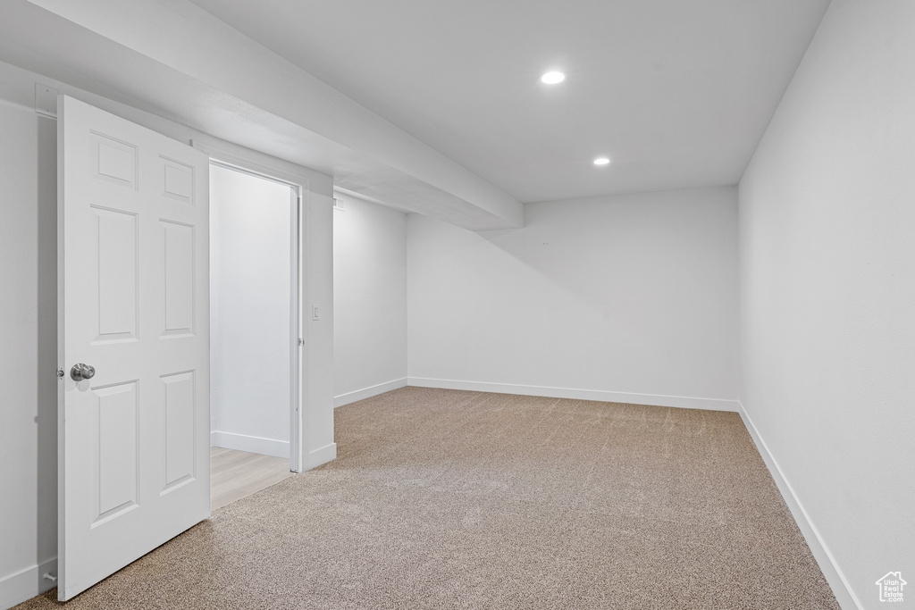 Basement with light carpet