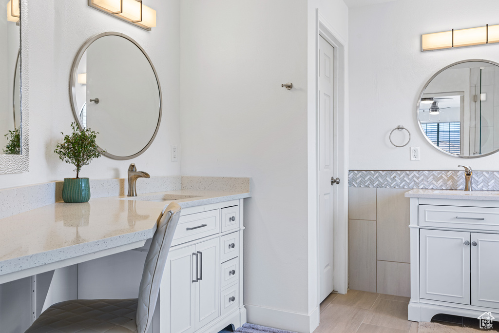 Bathroom with vanity and tile patterned floors