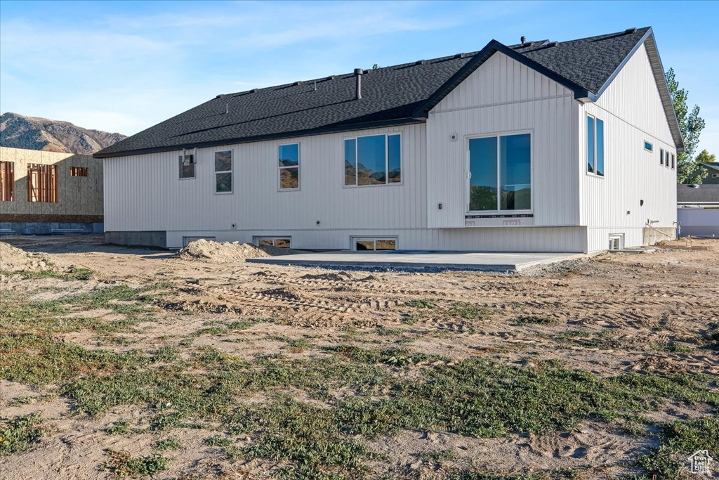 Back of property with a patio area