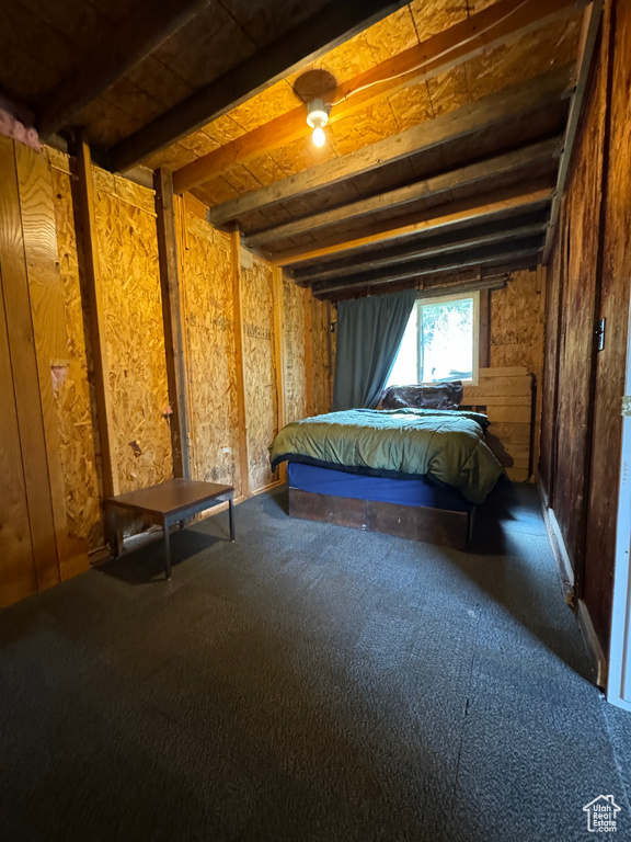 Unfurnished bedroom with beamed ceiling