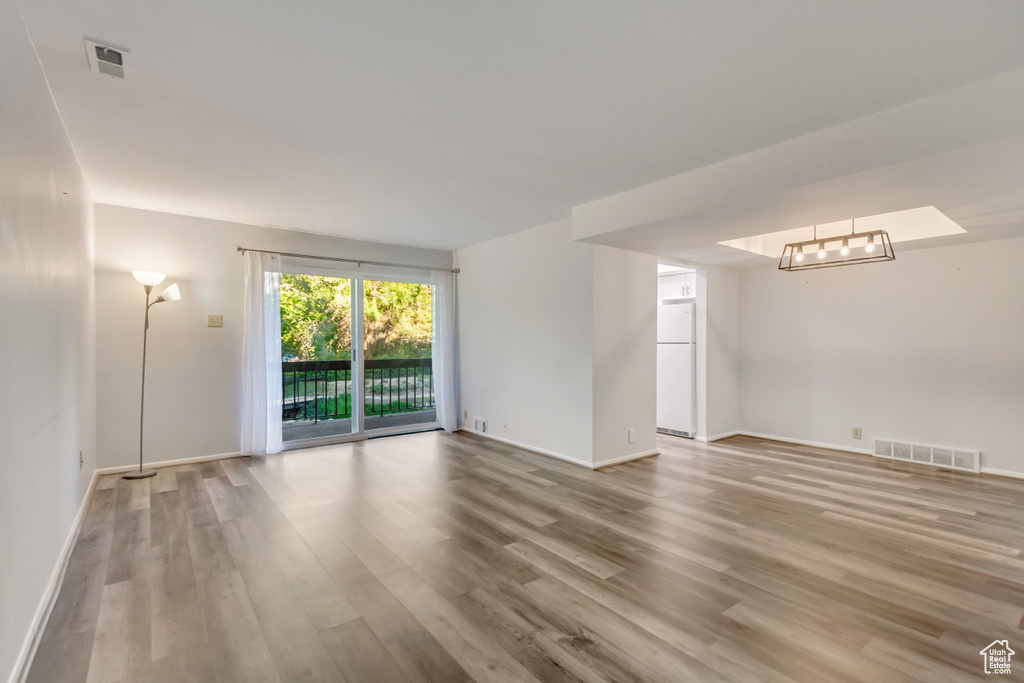 Unfurnished room with wood-type flooring