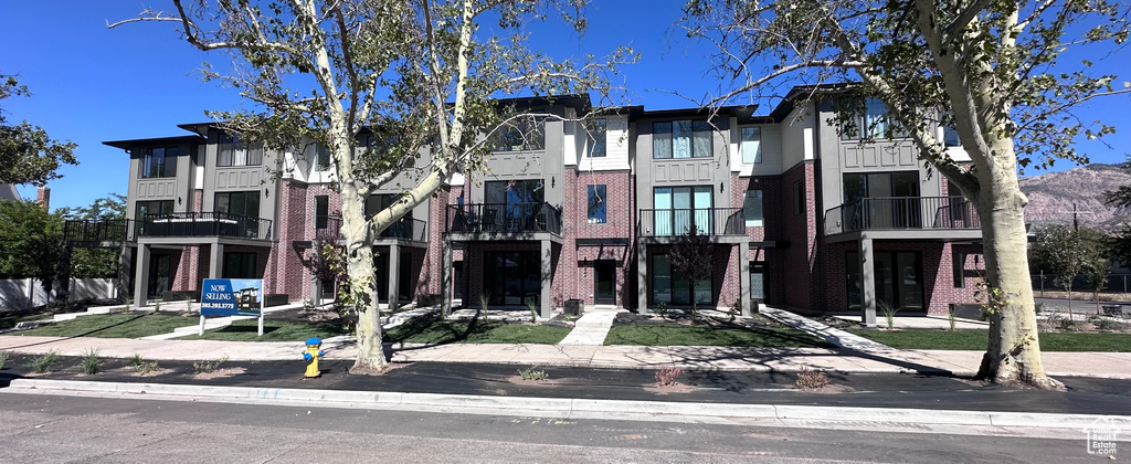 View of front of property featuring a balcony