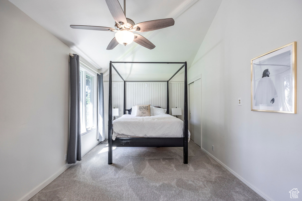 Carpeted bedroom with ceiling fan