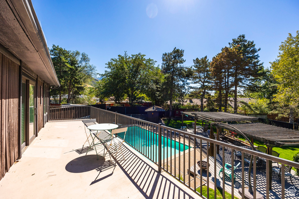 View of swimming pool with a patio