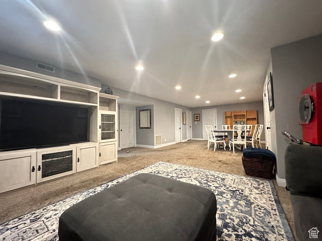 Living room featuring light carpet