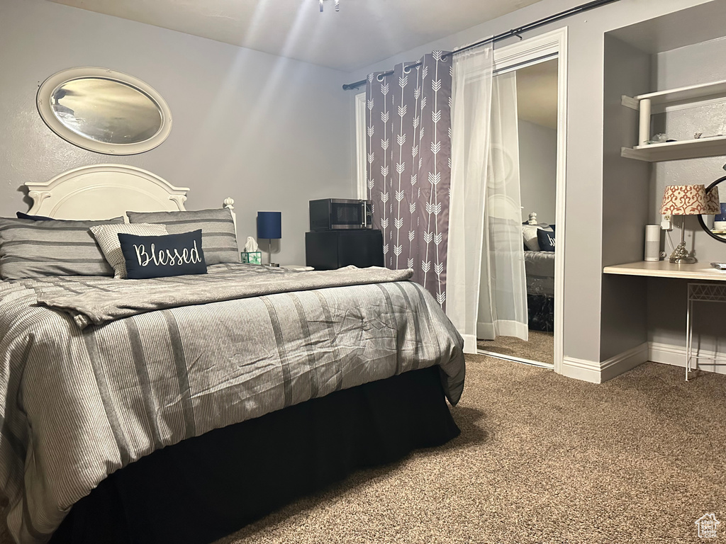 Bedroom with carpet flooring