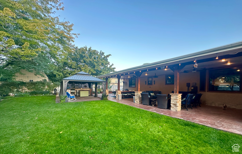 View of yard featuring a gazebo and a patio area