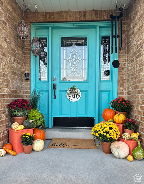 View of exterior entry with a porch