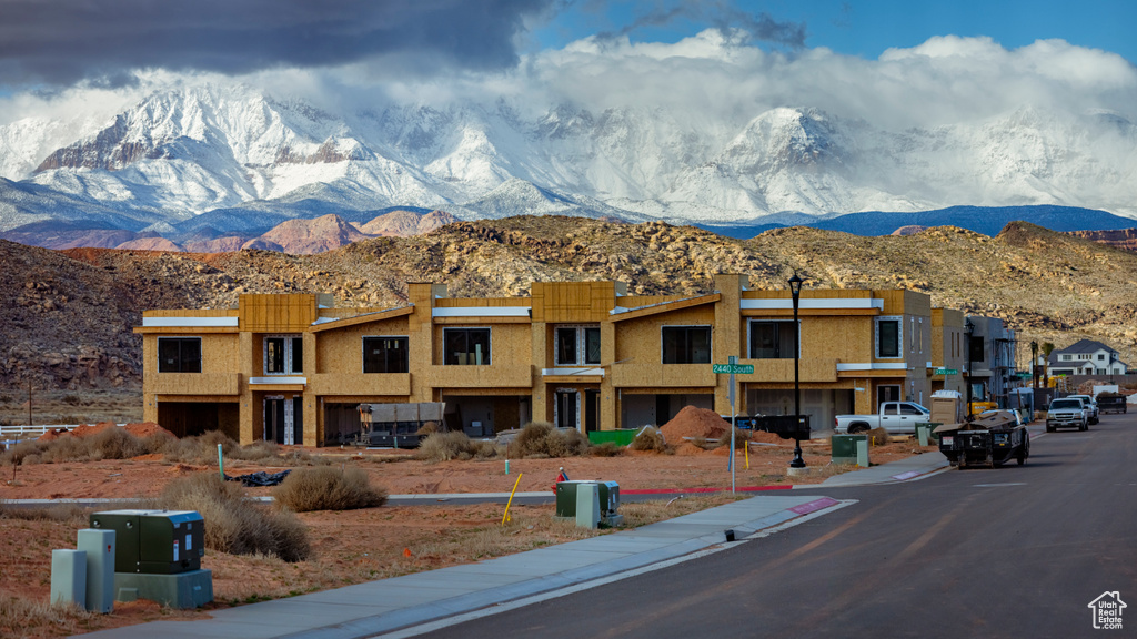 View of property with a mountain view