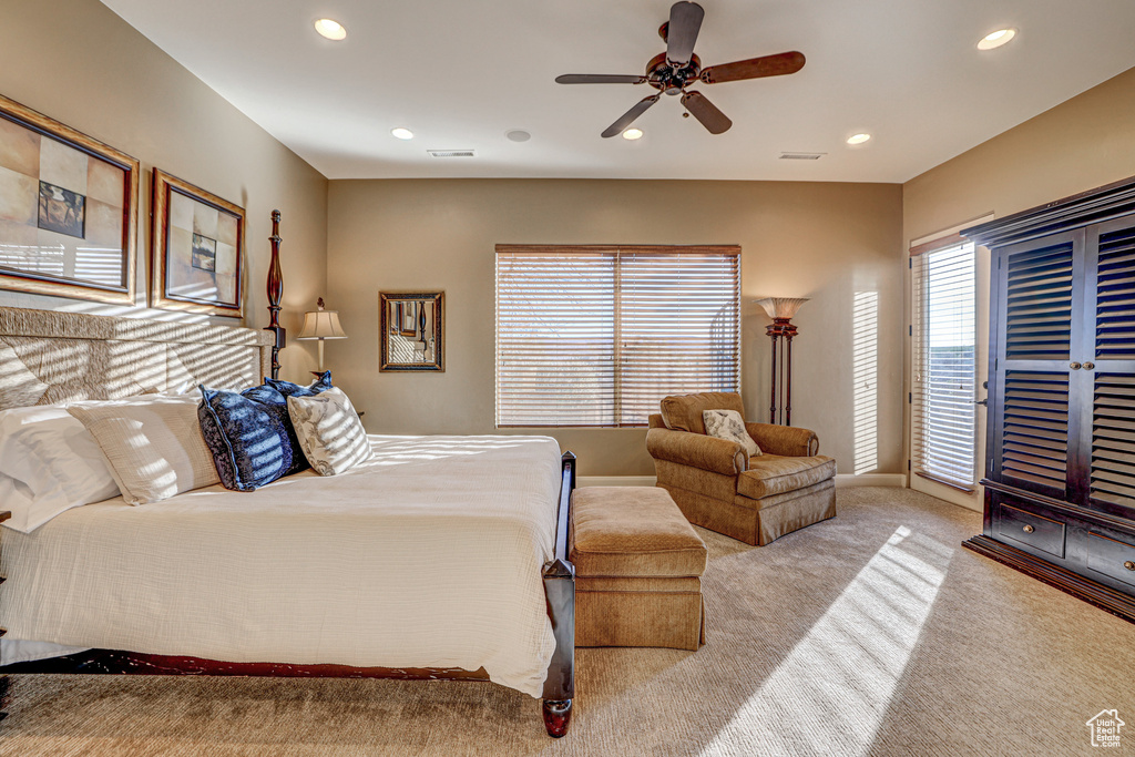 Bedroom featuring ceiling fan and light carpet