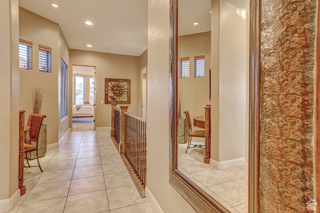 Hall featuring light tile patterned floors