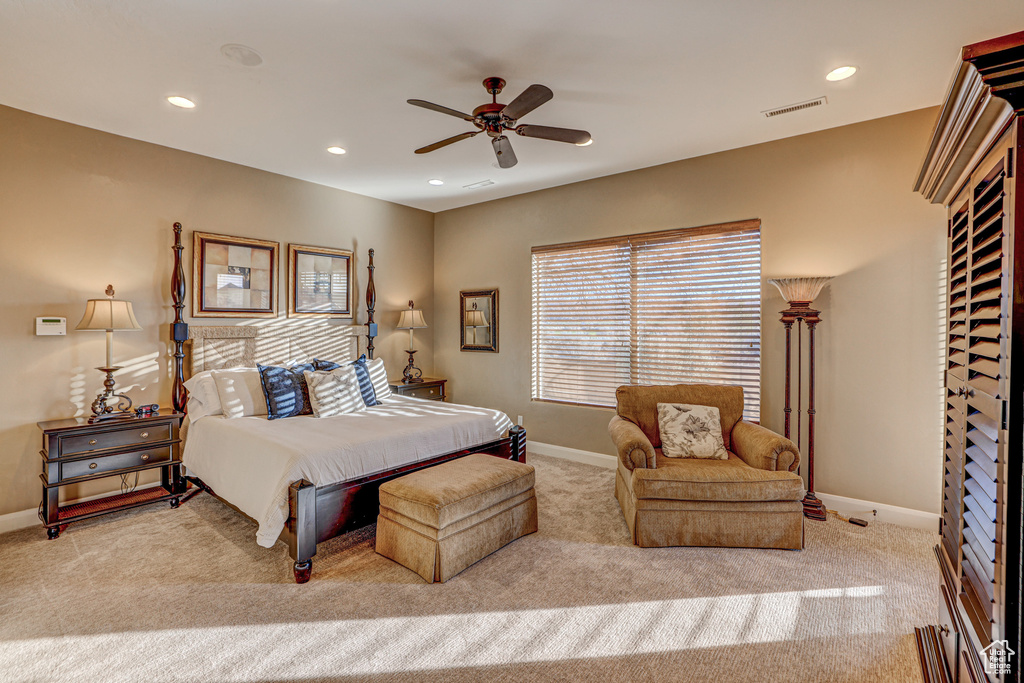 Carpeted bedroom with ceiling fan