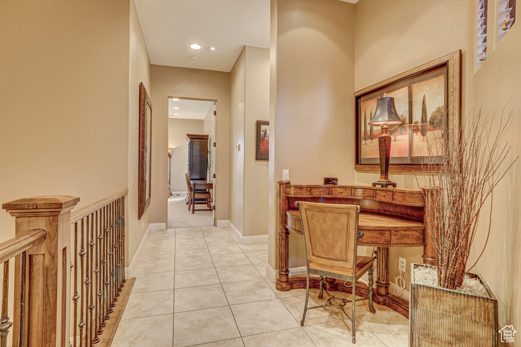 Hallway with light tile patterned floors