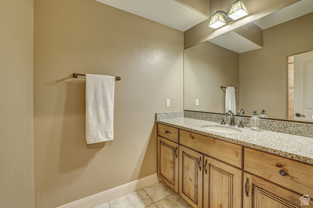 Bathroom featuring vanity and tile patterned flooring