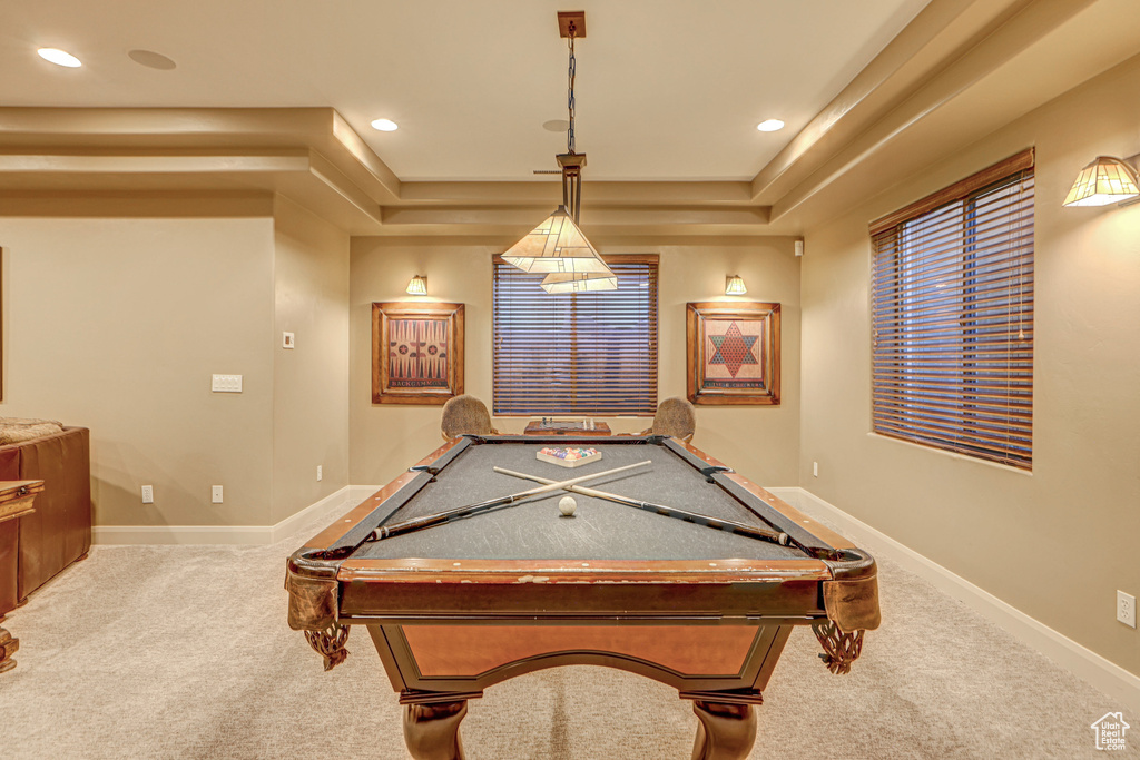 Game room featuring light carpet, billiards, and a tray ceiling