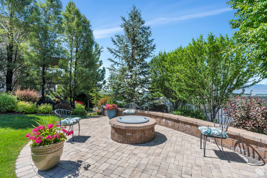 View of patio featuring a fire pit