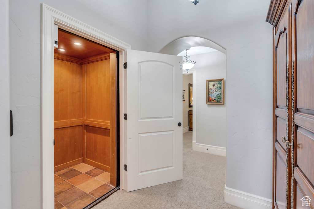 Hallway with light colored carpet