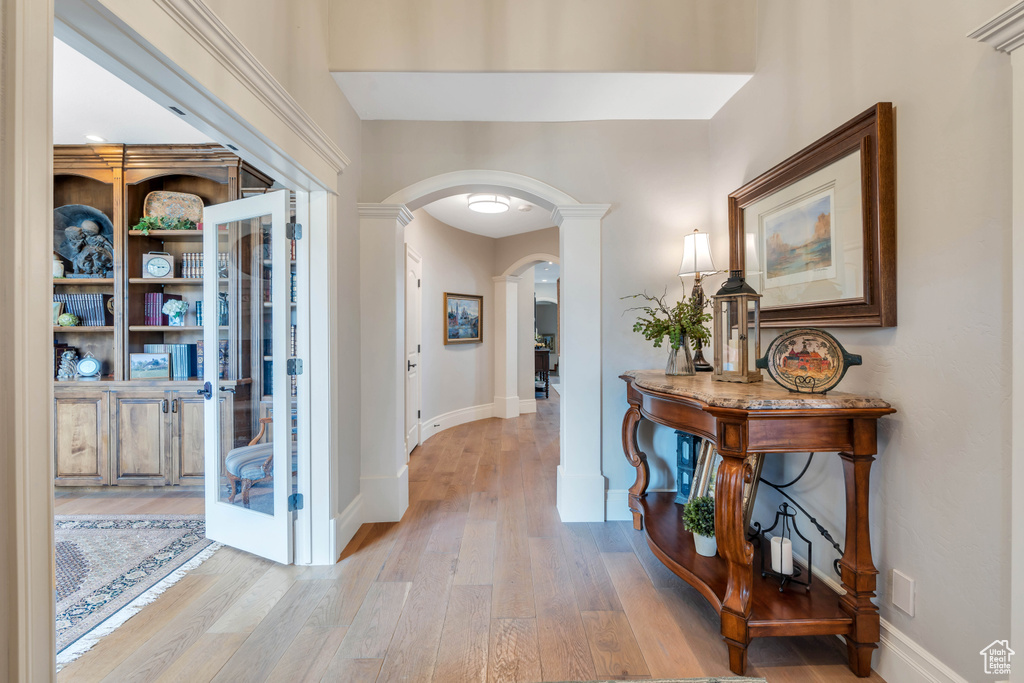 Hall with light hardwood / wood-style flooring