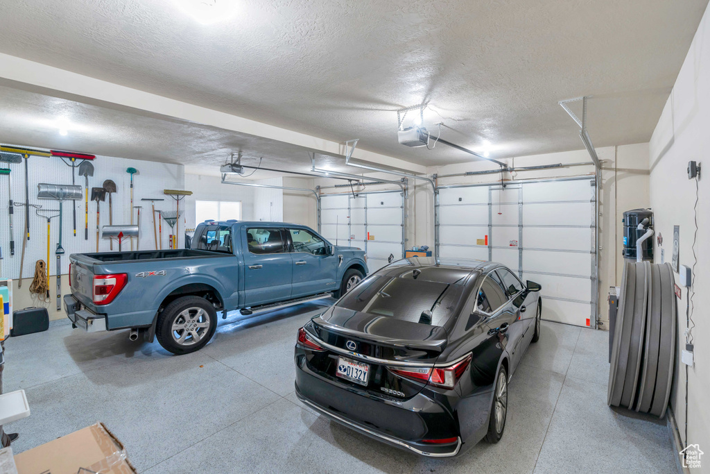 Garage featuring a garage door opener