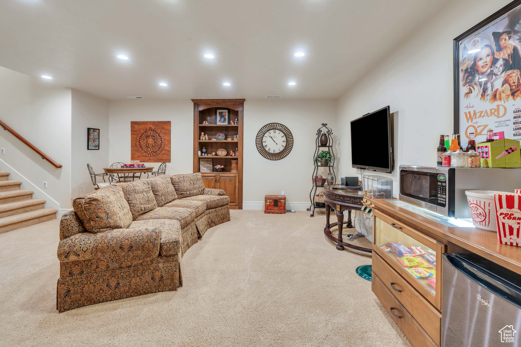 Living room featuring light colored carpet