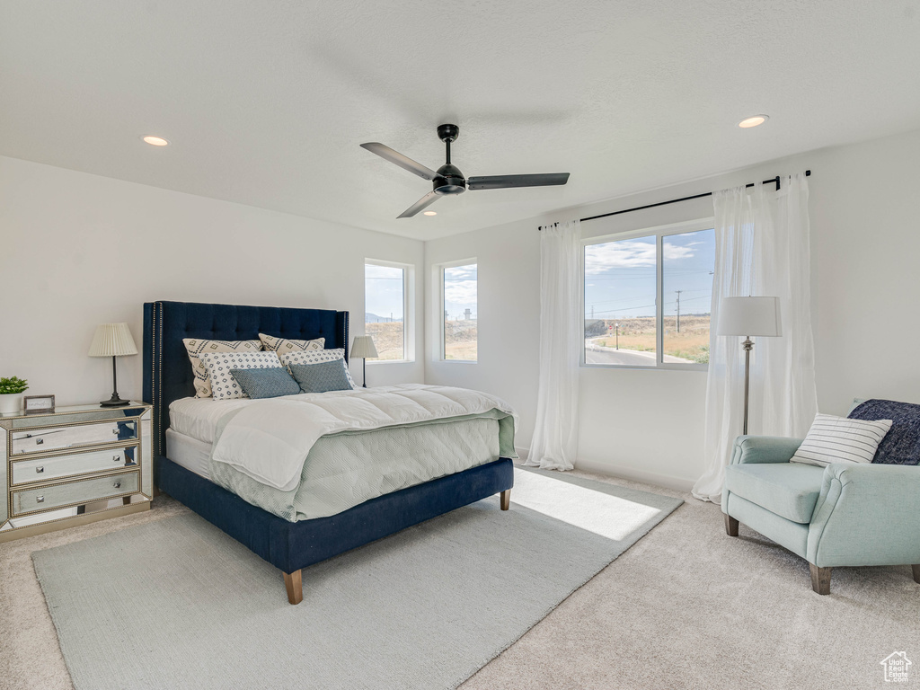 Bedroom featuring ceiling fan and carpet flooring