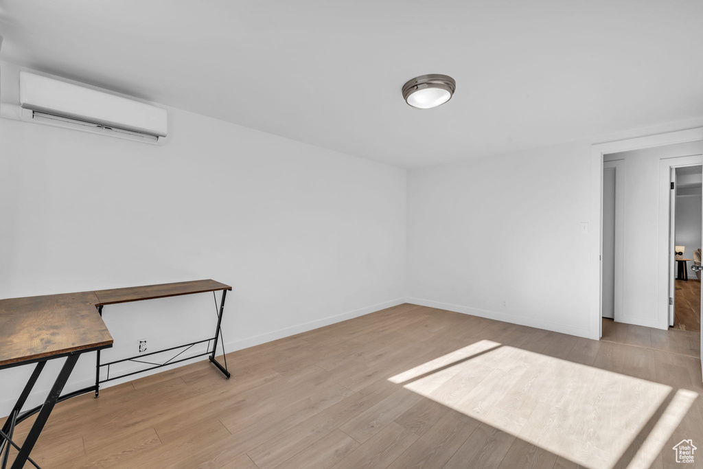 Interior space featuring light hardwood / wood-style floors and a wall mounted AC