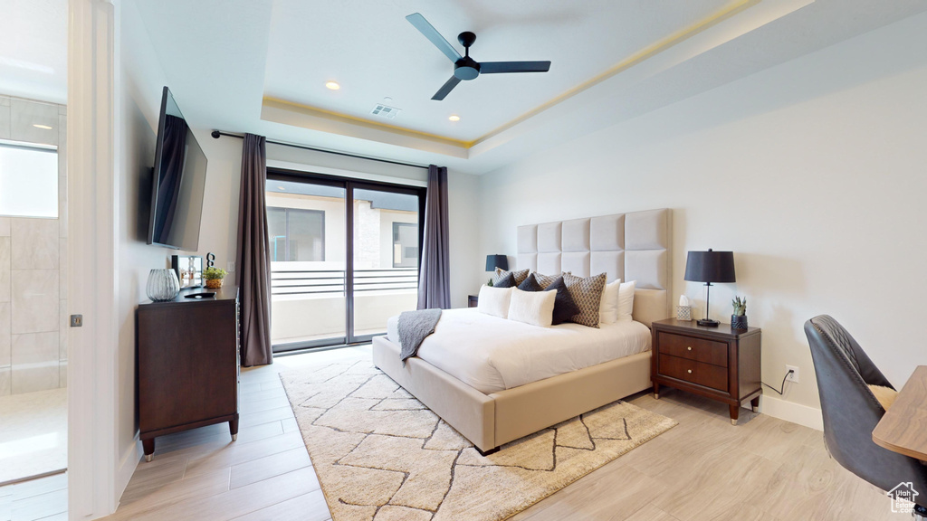 Bedroom with multiple windows, access to outside, light hardwood / wood-style floors, and ceiling fan