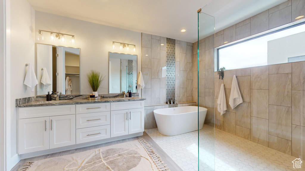 Bathroom with vanity, plus walk in shower, and tile patterned floors