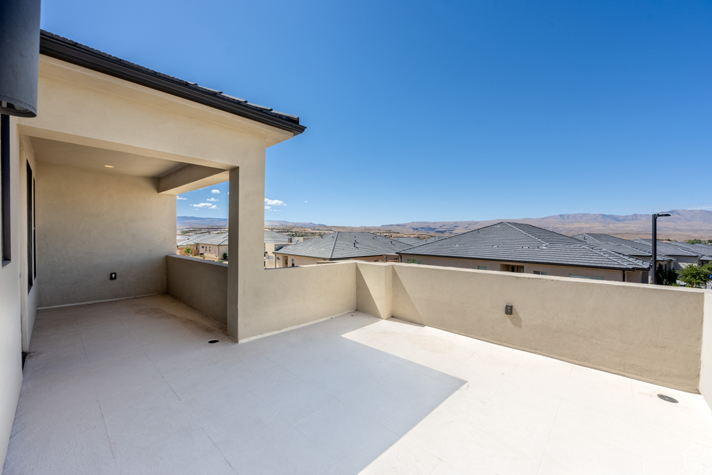 View of patio / terrace featuring a balcony and a mountain view