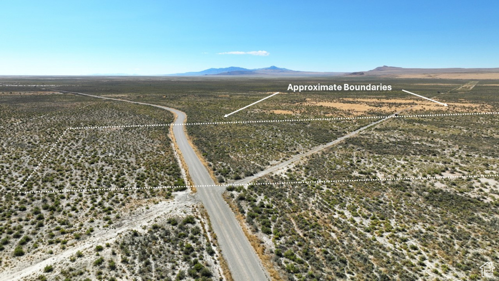Birds eye view of property featuring a mountain view and a rural view