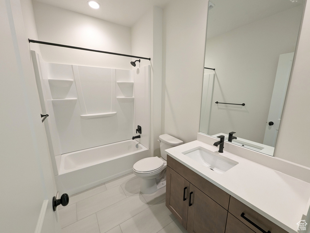 Full bathroom featuring tile patterned floors, shower / washtub combination, vanity, and toilet