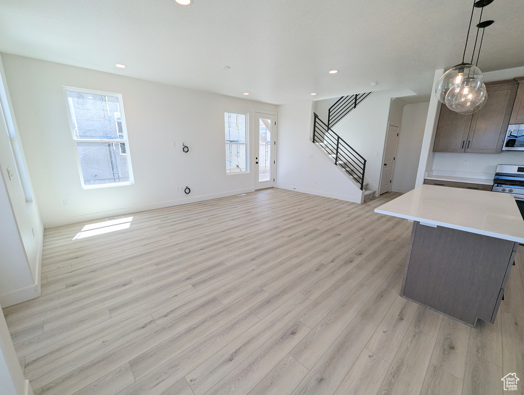 Living room with light hardwood / wood-style floors