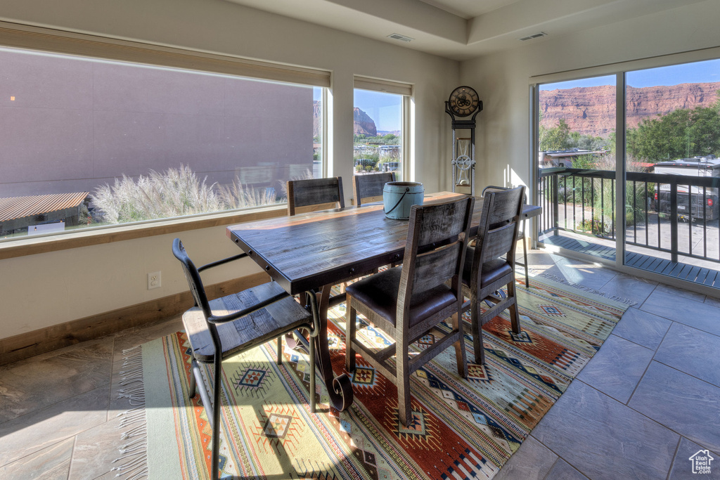 Dining space with a mountain view and a wealth of natural light