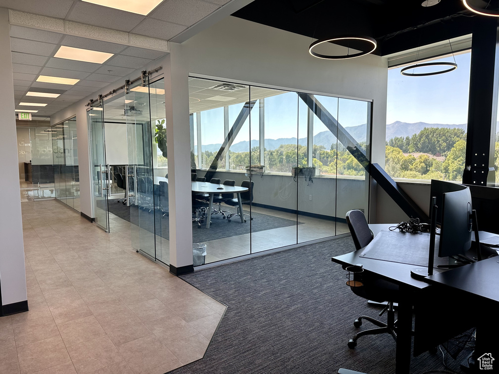 Office with a paneled ceiling