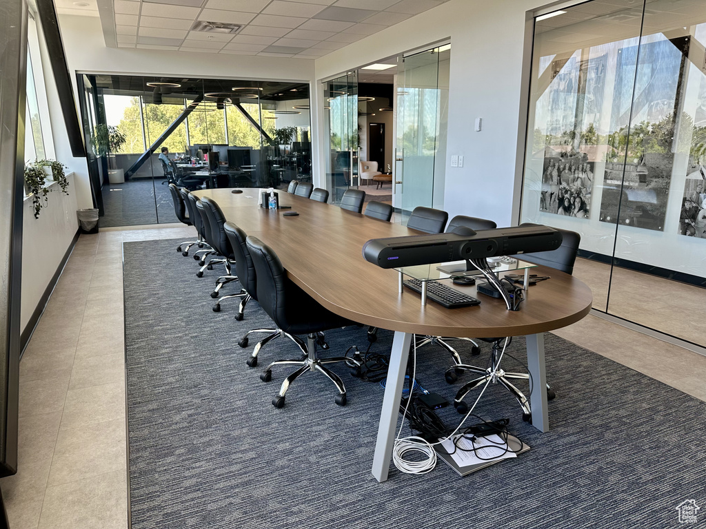 Tiled office featuring a drop ceiling